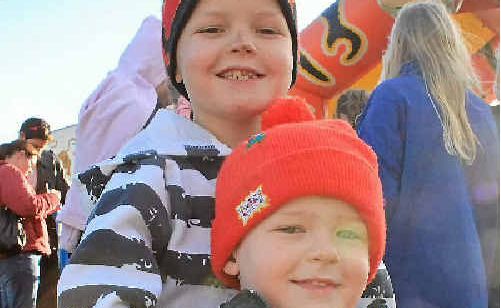 Zachary and Jacob Fleming-Kasper keep warm in their red beanies. Zachary and Jacob Fleming-Kasper keep warm in their red beanies.